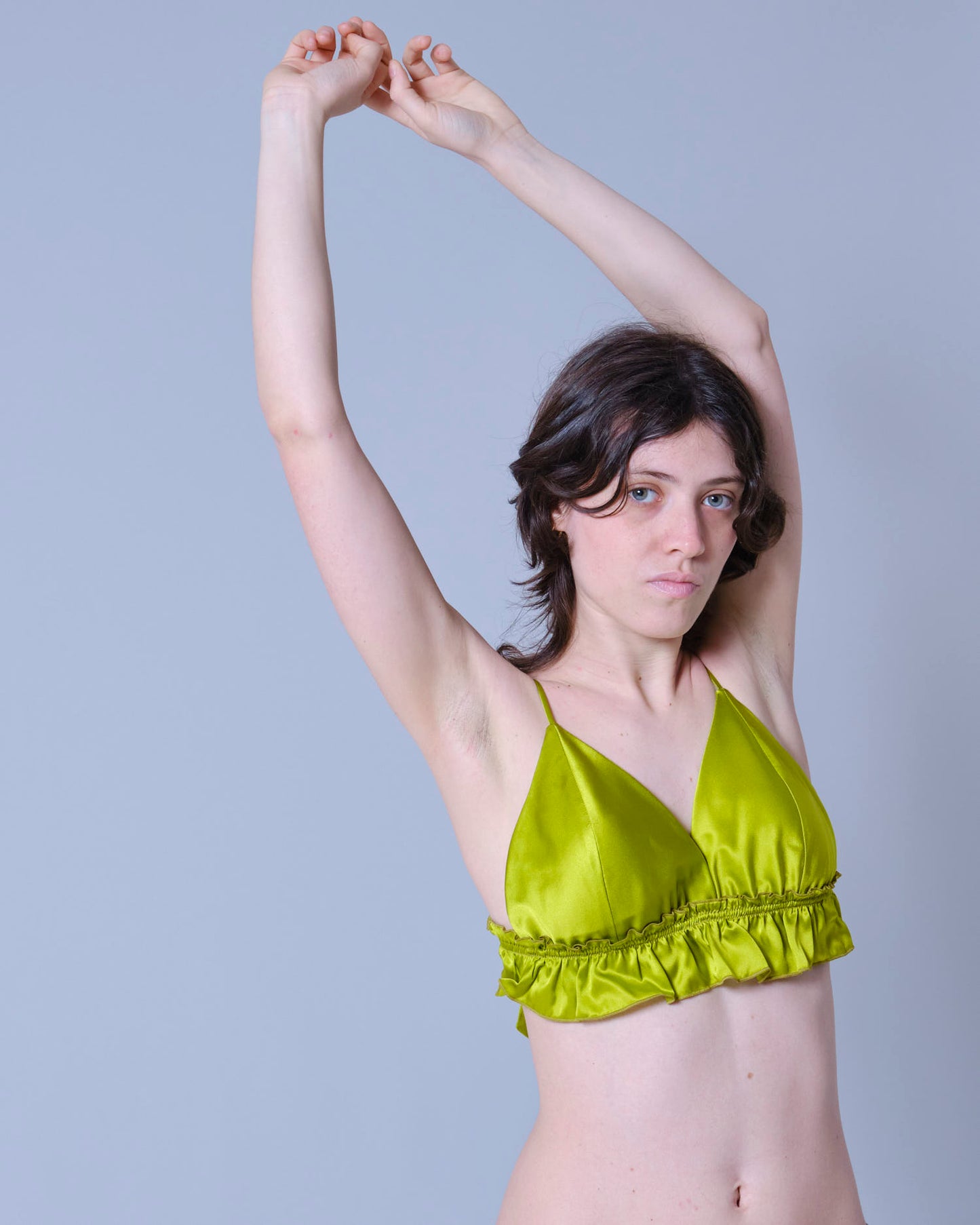 Top Memphis variante verde olio